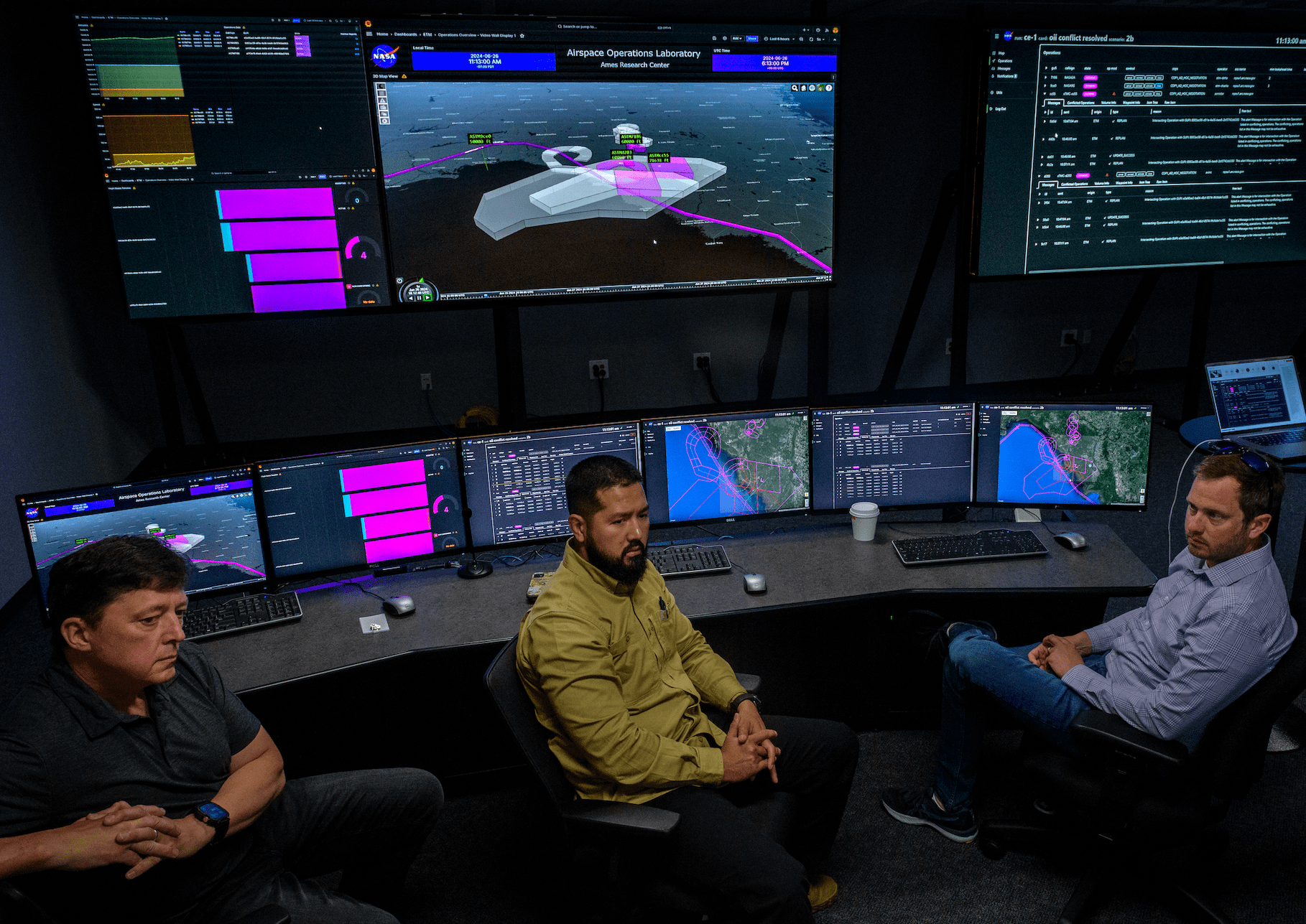 NASA and partners from Aerostar and AeroVironment discuss a simulation of a high-altitude air traffic management system in the Airspace Operations Lab at NASA’s Ames Research Center in California’s Silicon Valley.